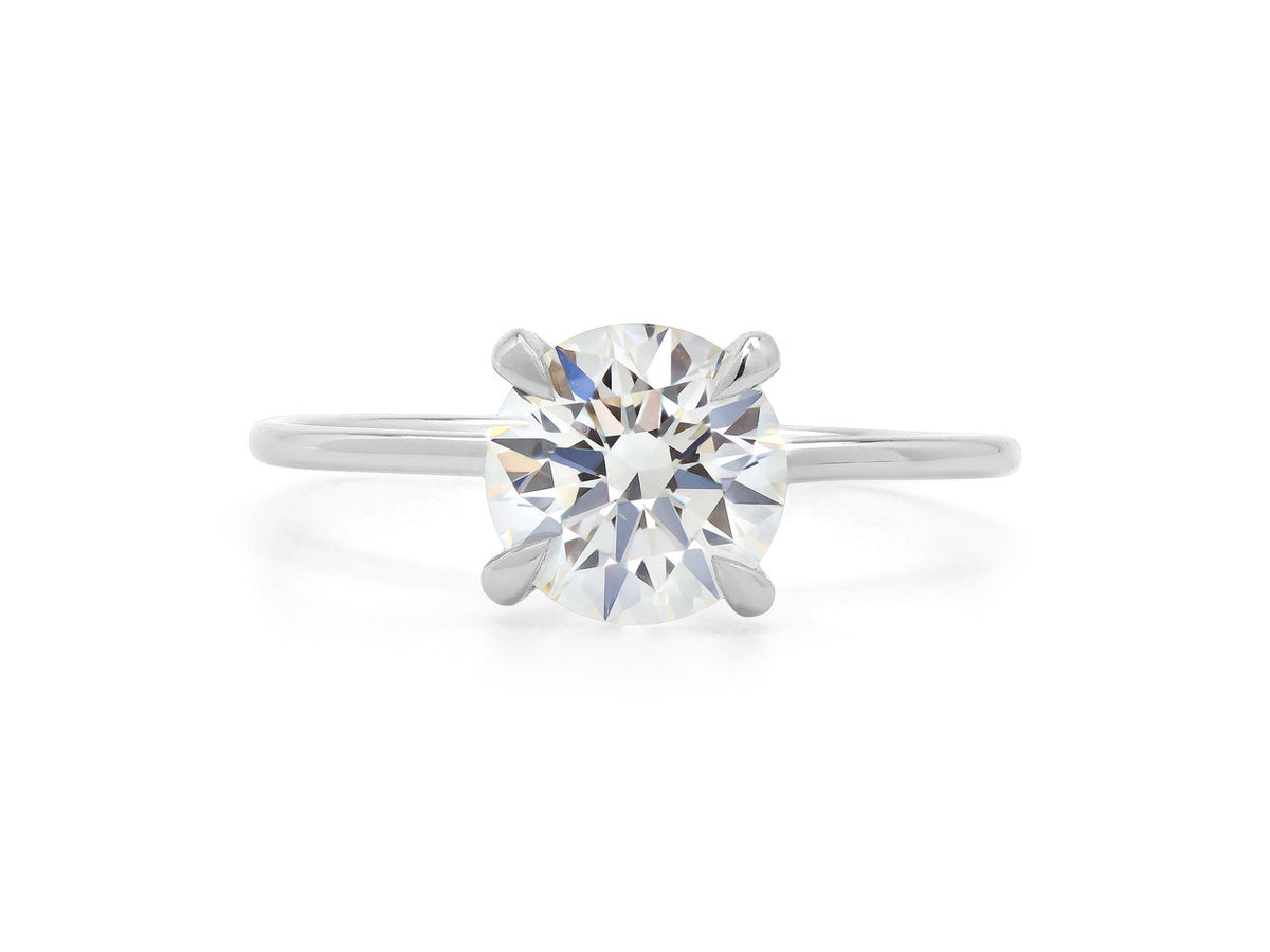 Round brilliant cut diamond ring in platinum band
