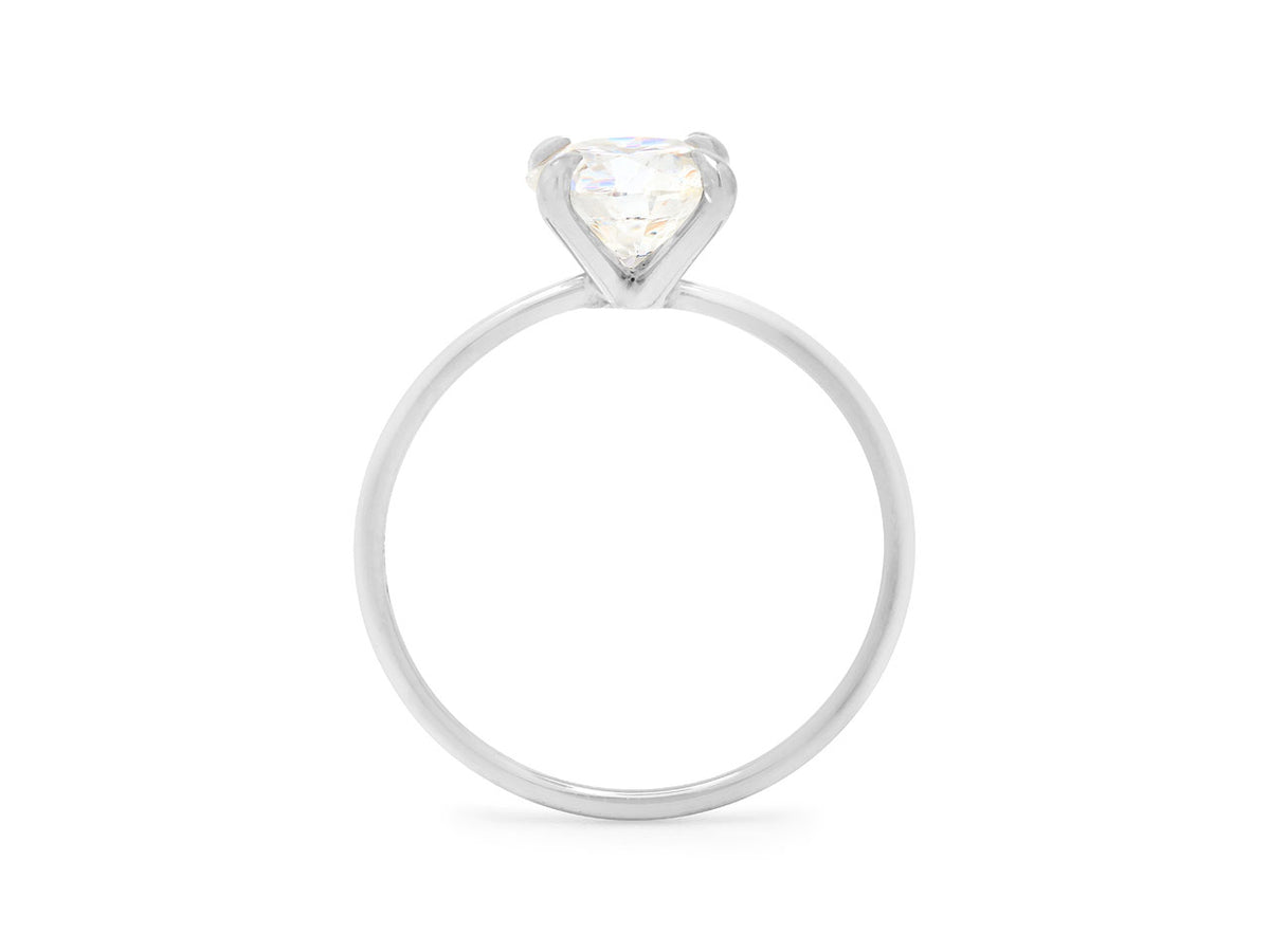 Side view of a platinum ring with a prong set diamond