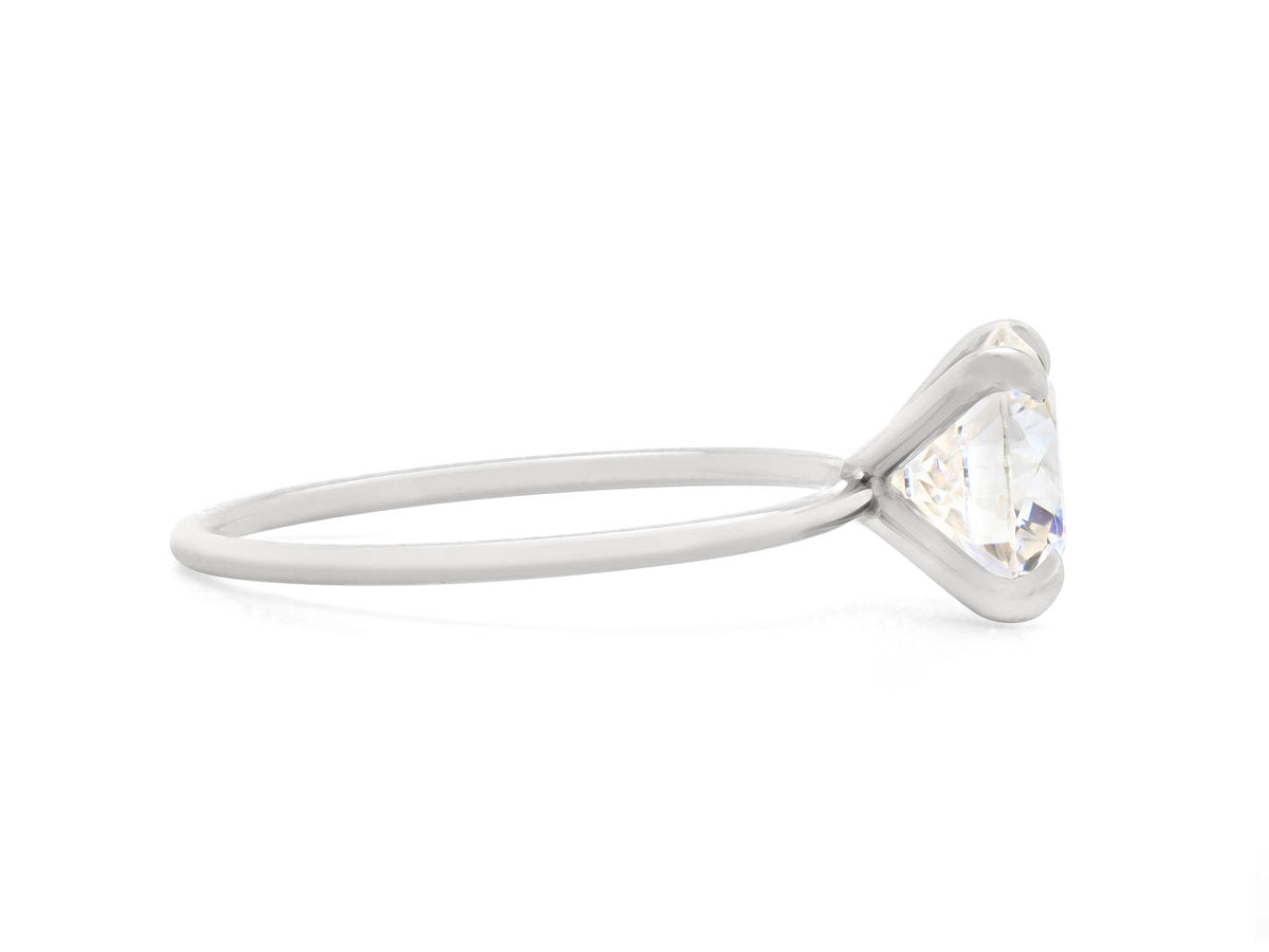 Side view of a round diamond ring with platinum band