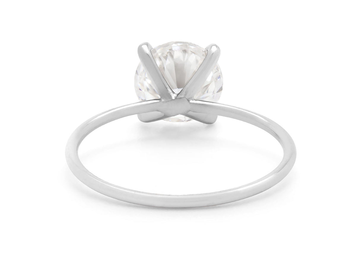 Side view of a round diamond ring with platinum band