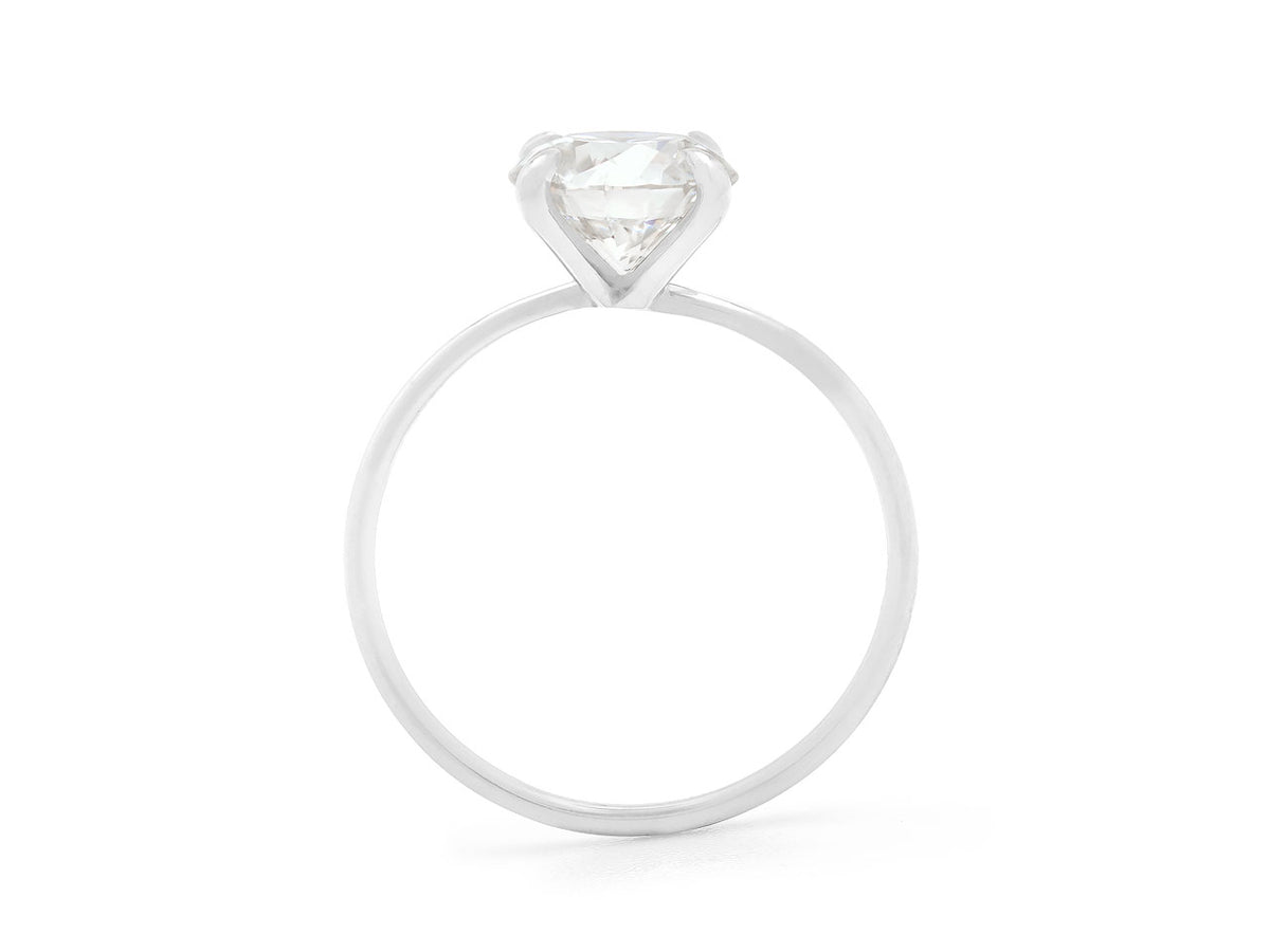 Profile view of a platinum ring with prong set diamond