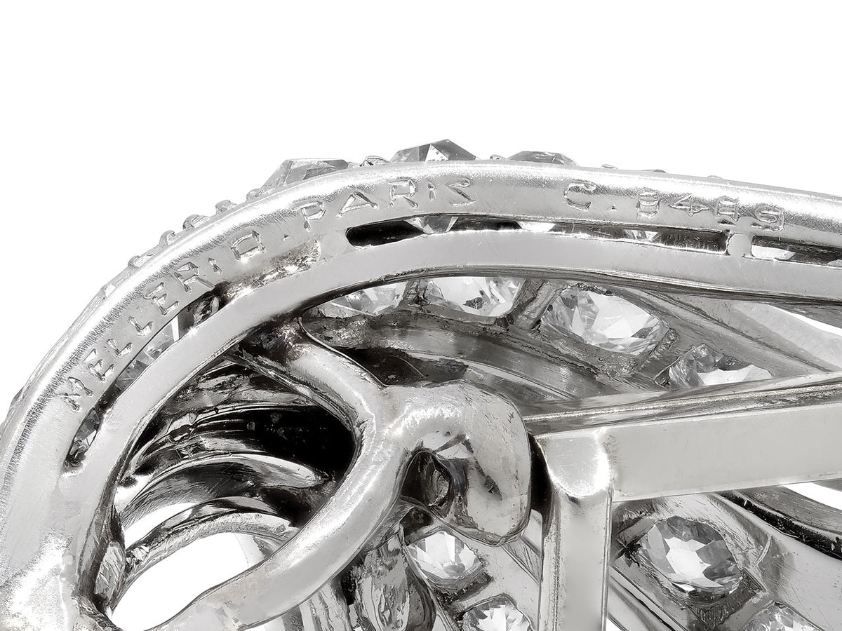Close up of platinum brooch setting with engraved hallmark