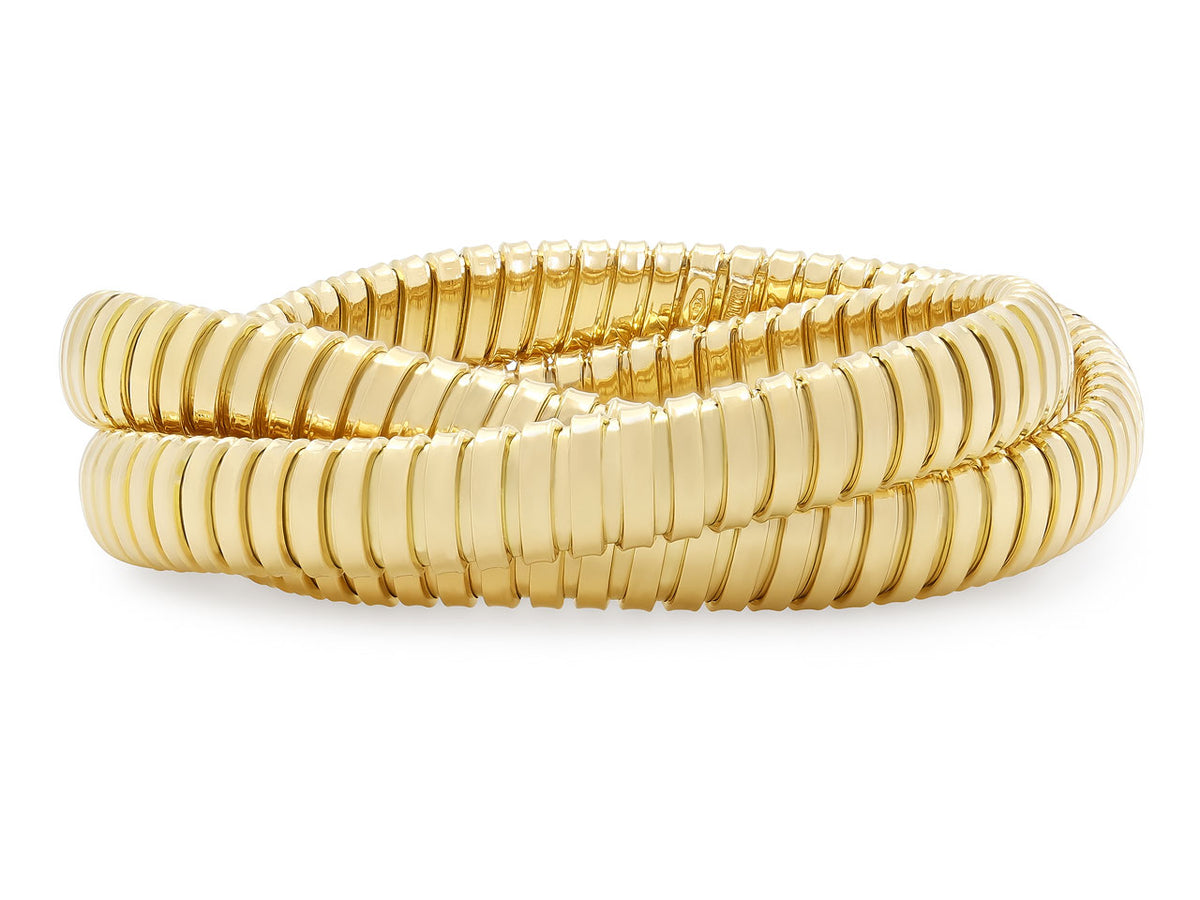 Three interlocking 18K yellow gold tubogas bracelets
