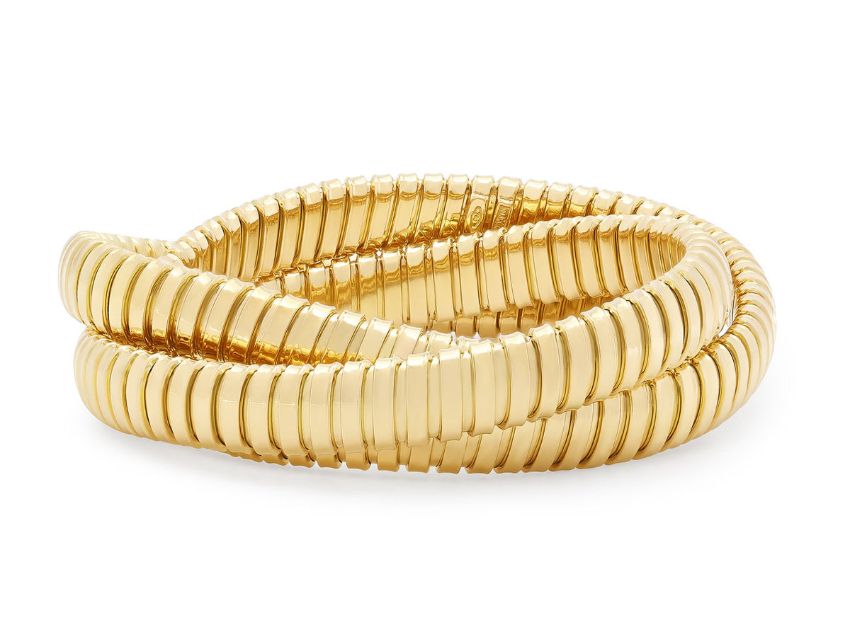Three interlocking 18K yellow gold tubogas bracelets