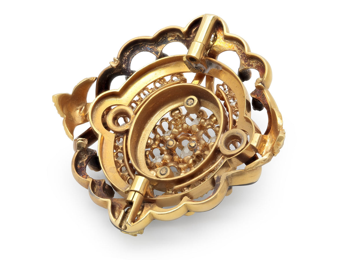 Back view of an ornate 18K gold bracelet with diamonds