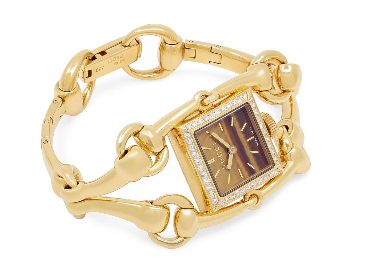 Gucci gold horsebit watch with tiger eye dial and diamond bezel