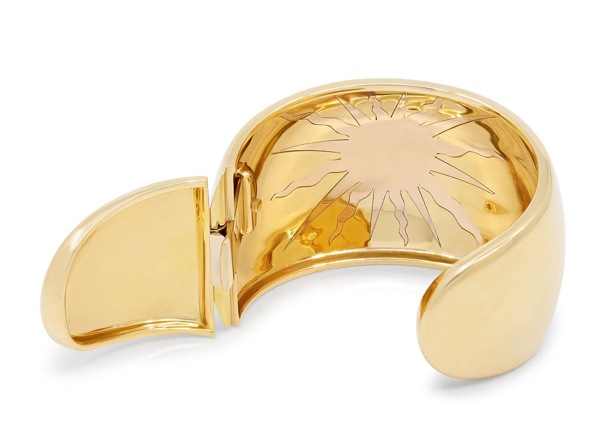 Open hinged 18K gold cuff with rose gold sun motif