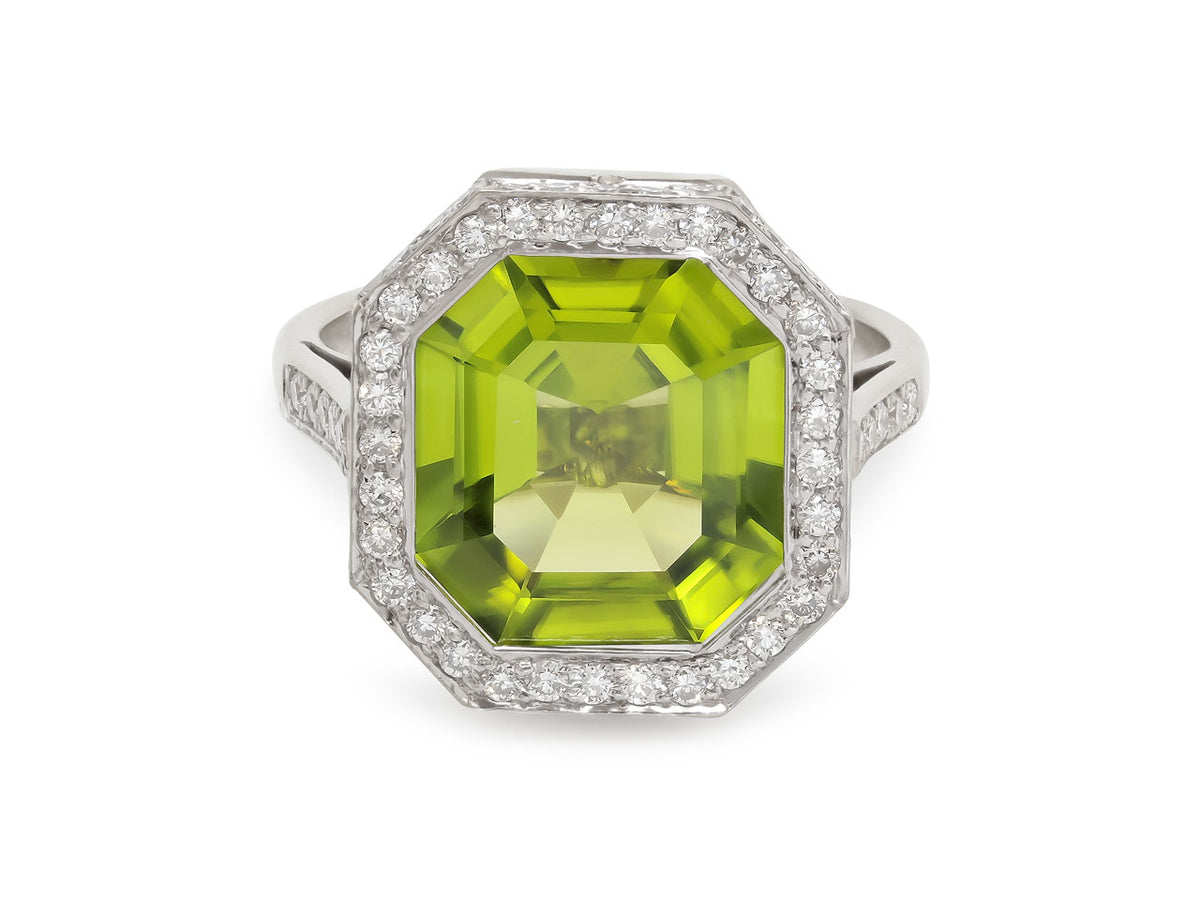 Square step cut peridot ring with diamond halo in white gold