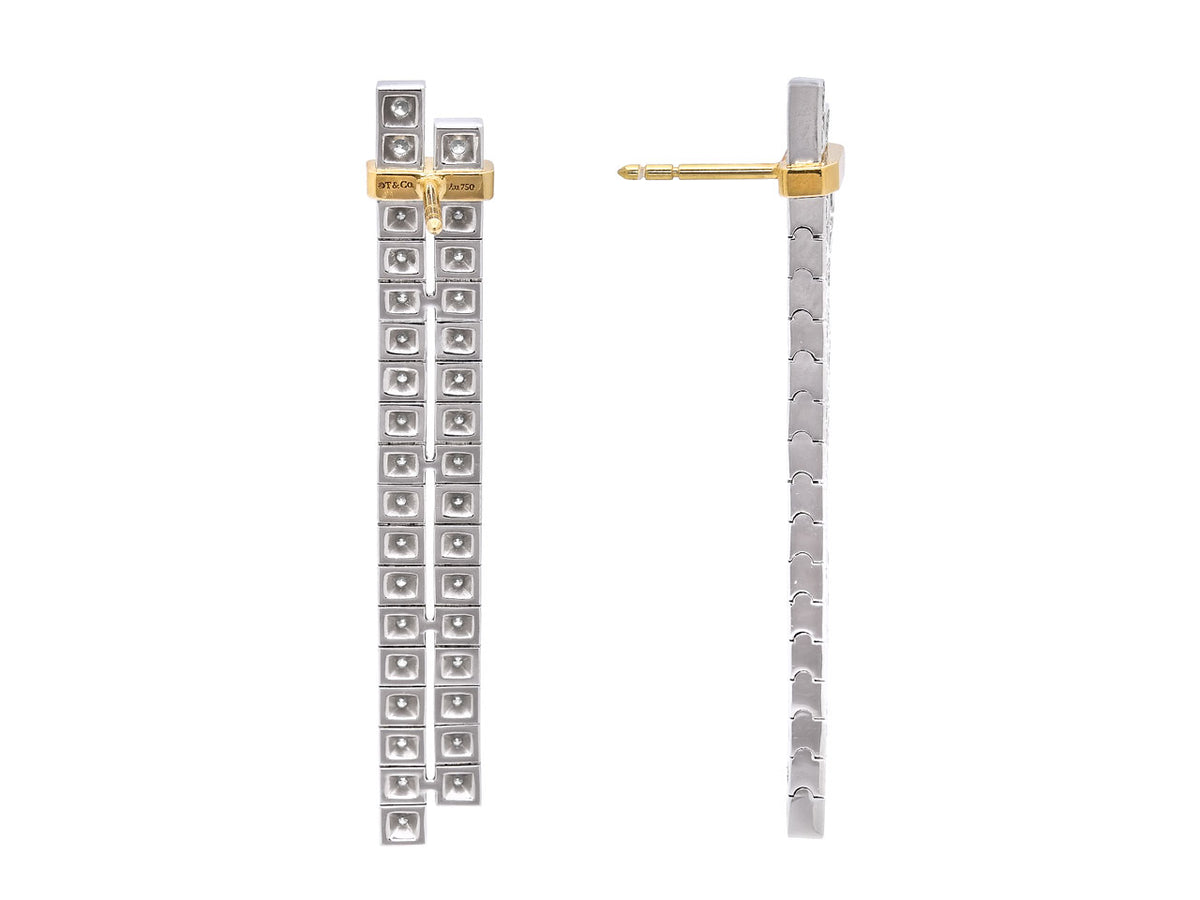 Platinum and gold diamond drop earrings shown front and side