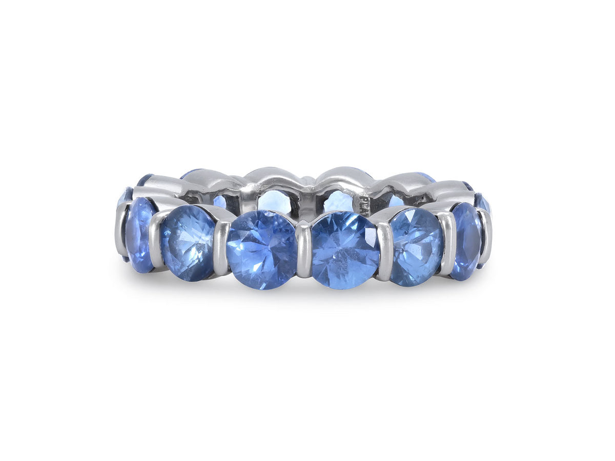 Platinum eternity band with round blue sapphires