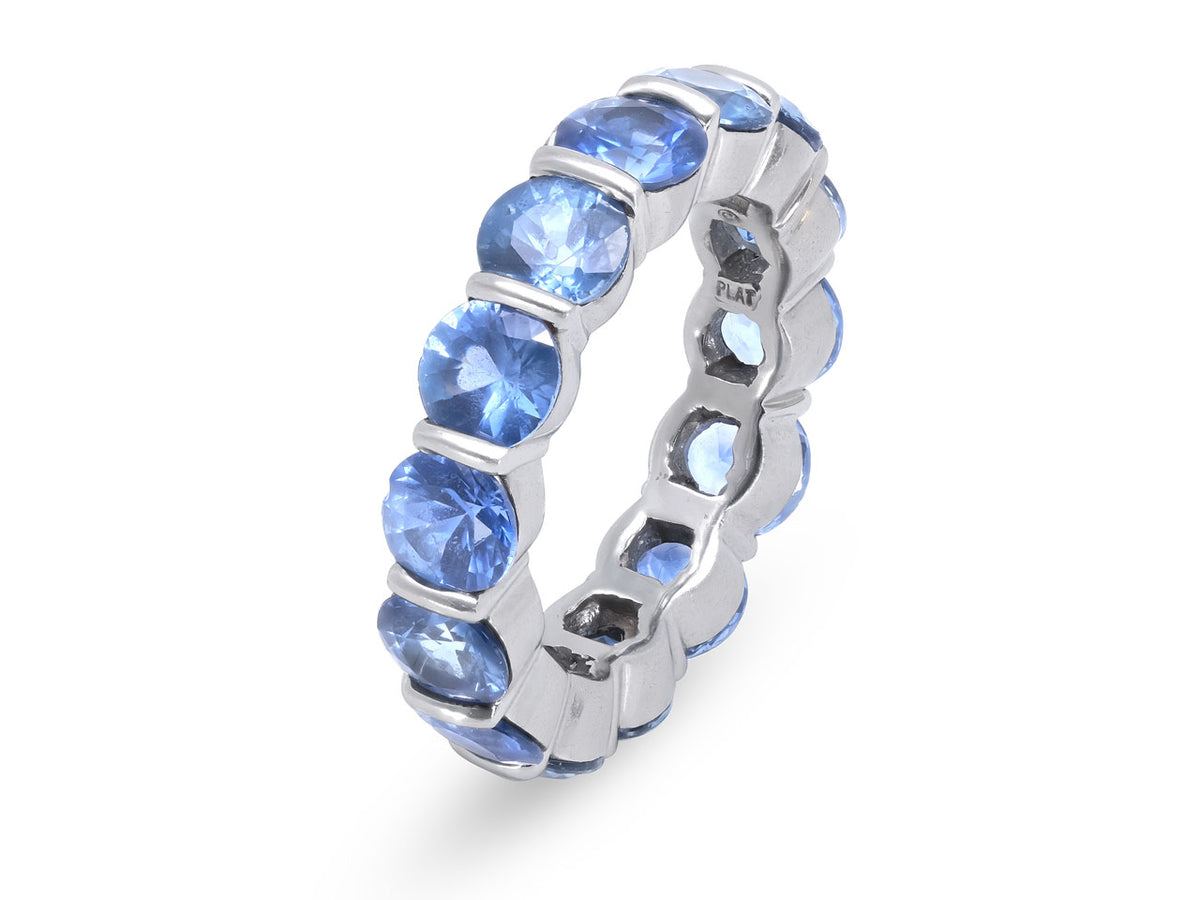 Platinum eternity band with fourteen round blue sapphires