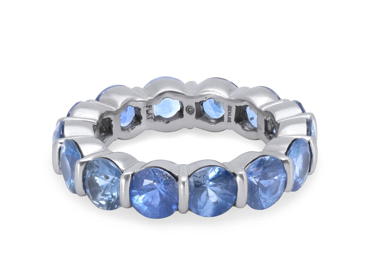 Platinum eternity band with round blue sapphires