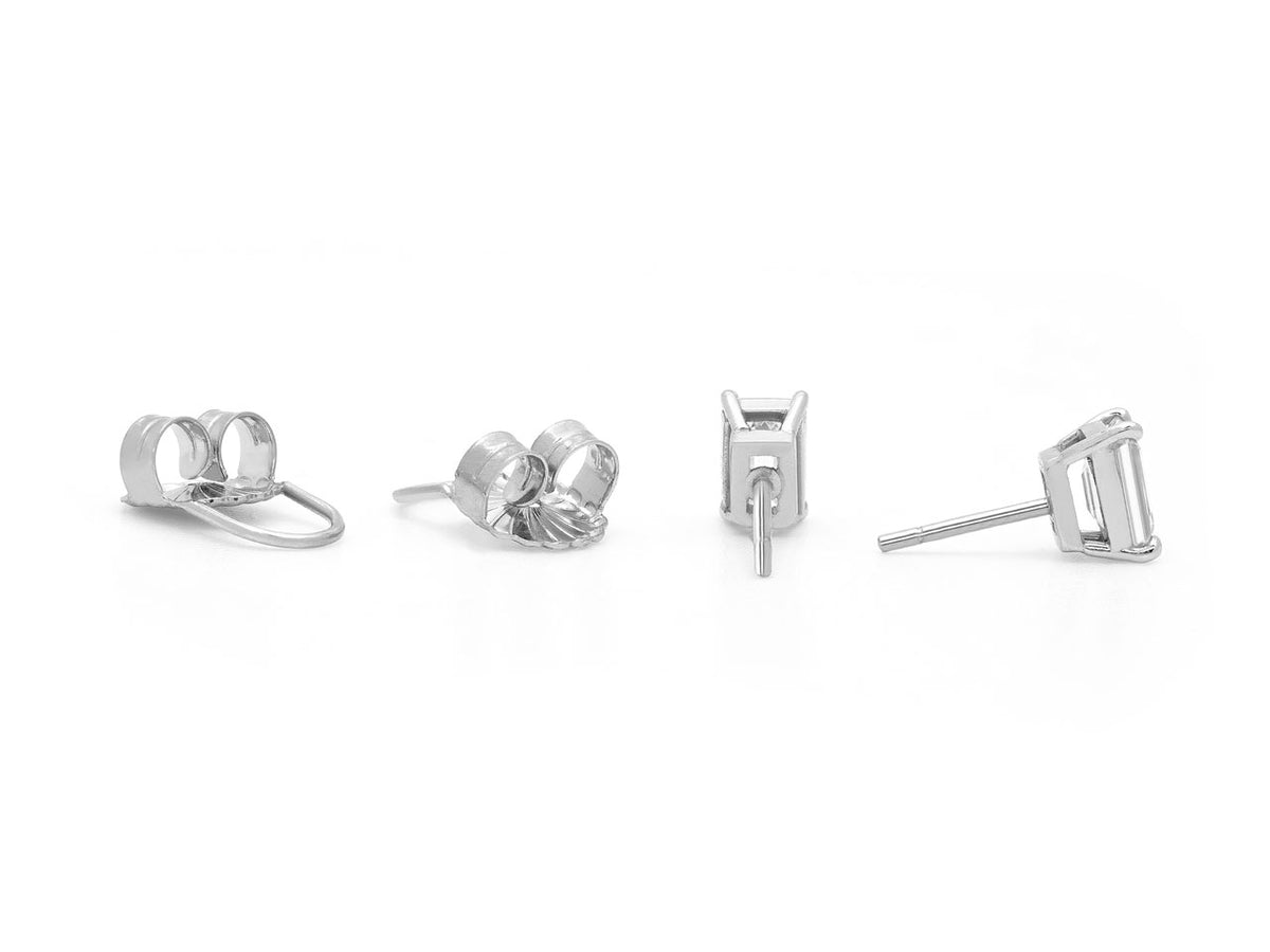 Platinum stud earrings with four prong settings and backs