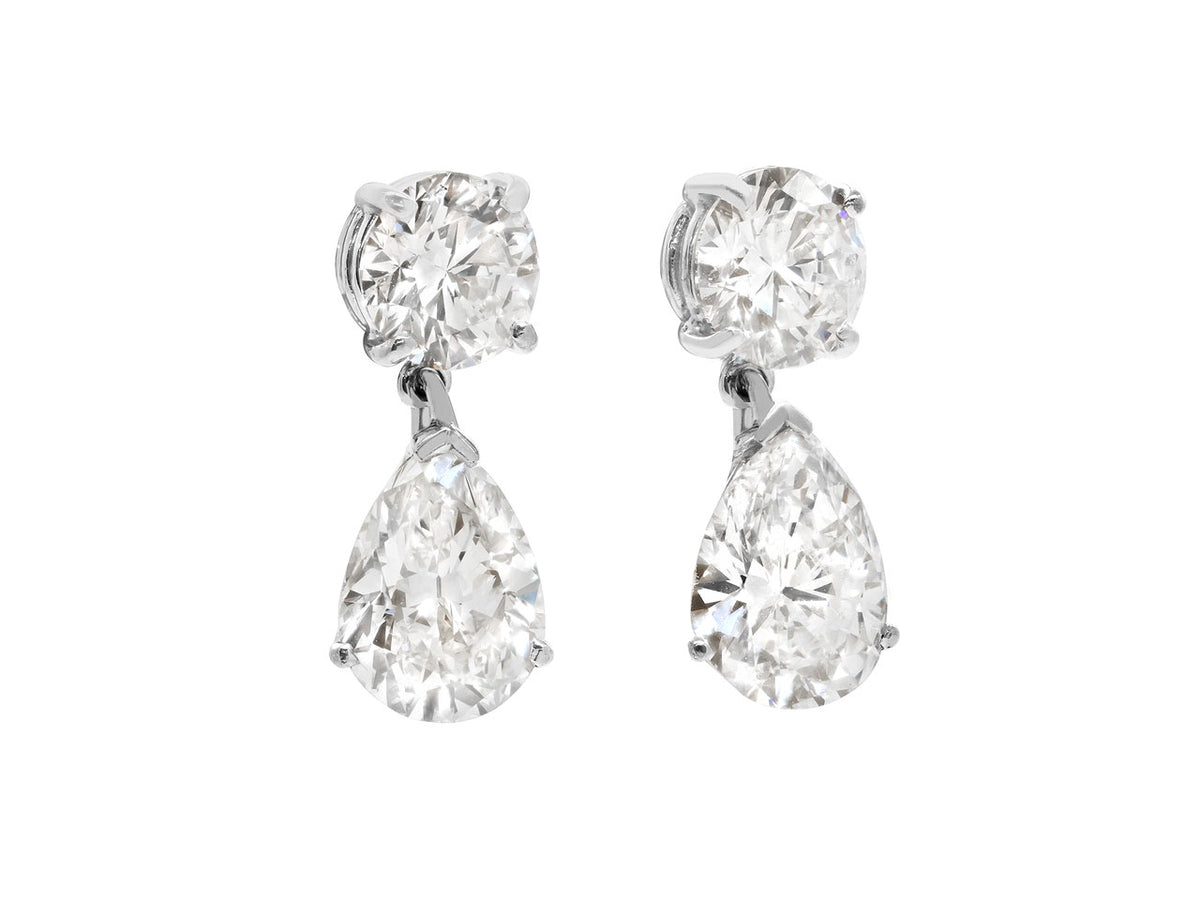 Platinum diamond drop earrings with pear shaped pendants