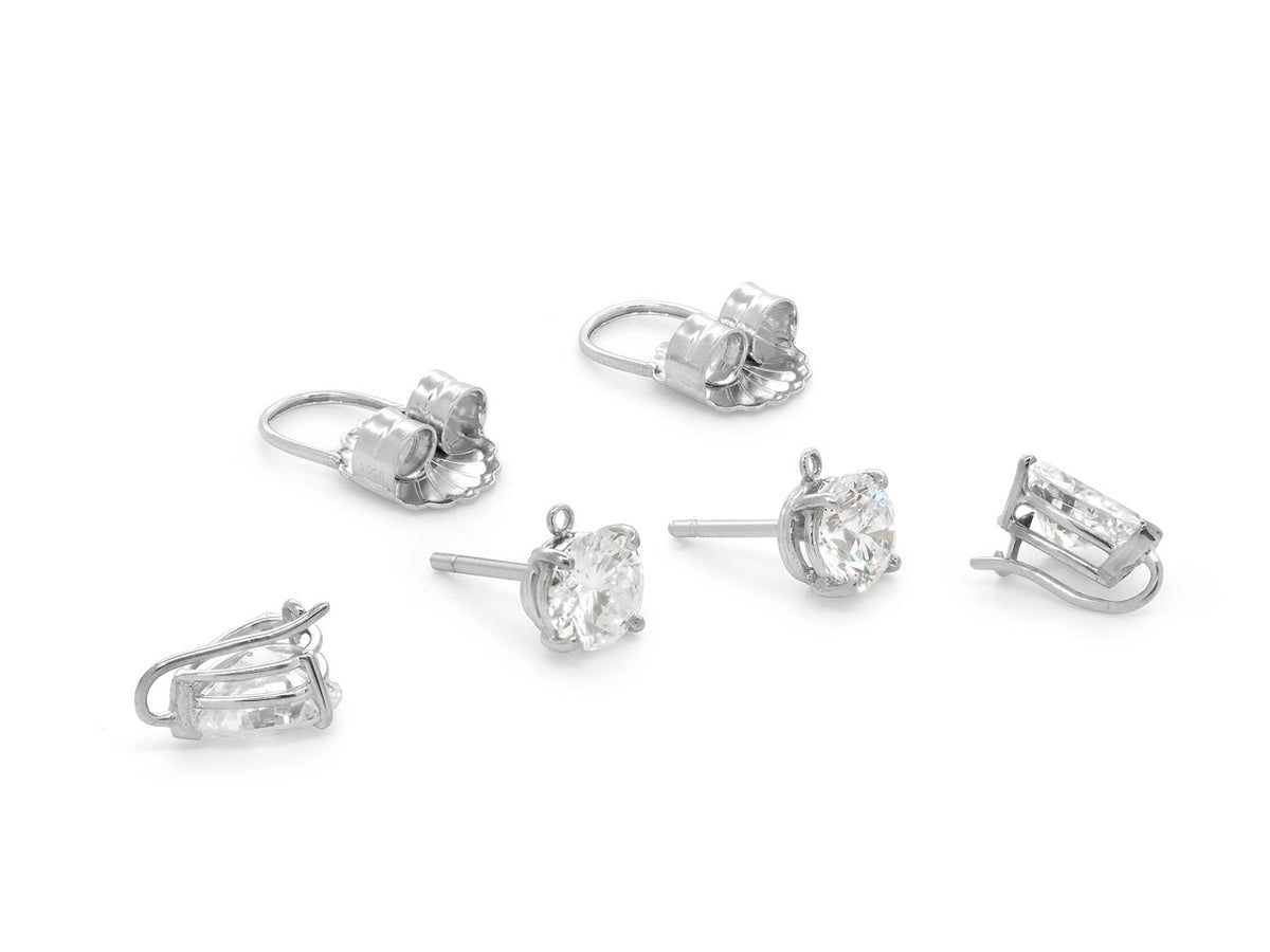 Platinum diamond drop earrings with pear shaped drops