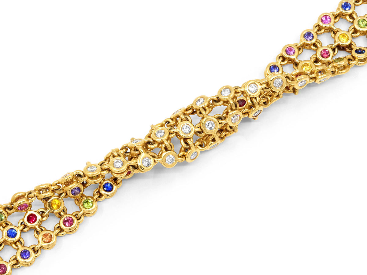 18K gold bracelet with diamond links and multicolored sapphire and ruby accents