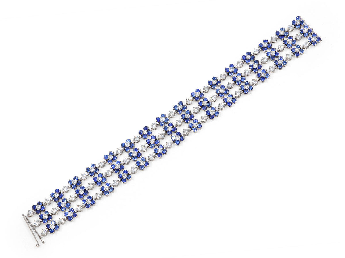 Blue sapphire and diamond floral bracelet in white gold
