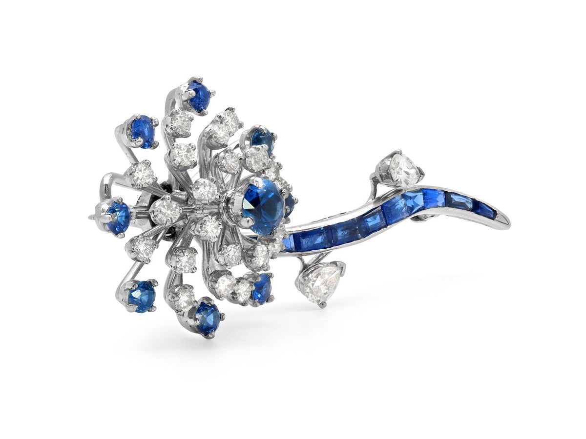 Platinum flower brooch with diamonds and blue sapphires