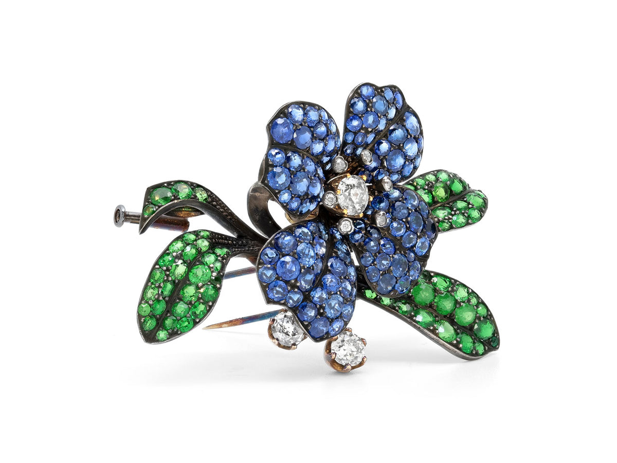 Antique sapphire and demantoid garnet flower brooch with diamonds