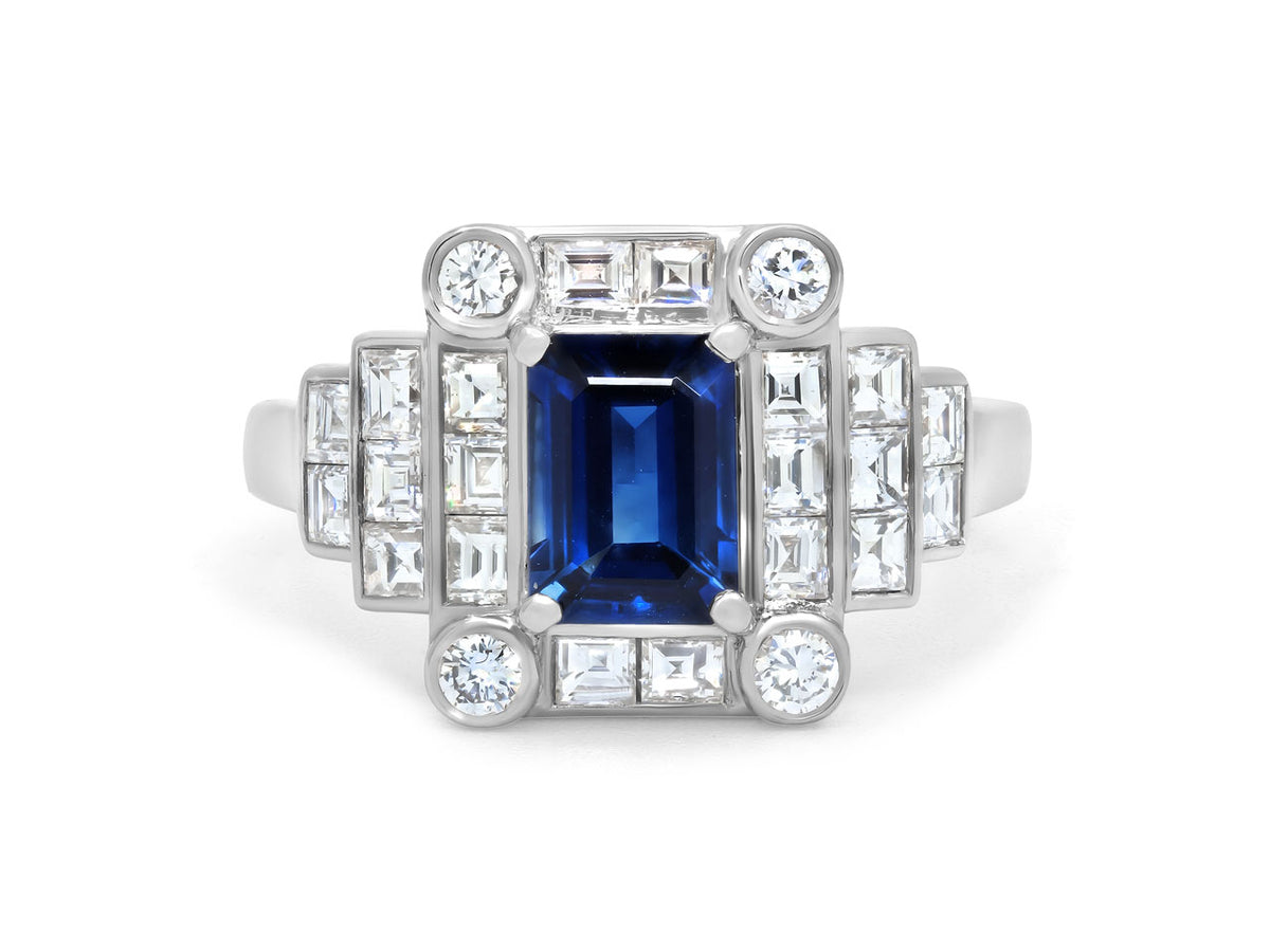 Platinum ring with blue sapphire and diamond accents