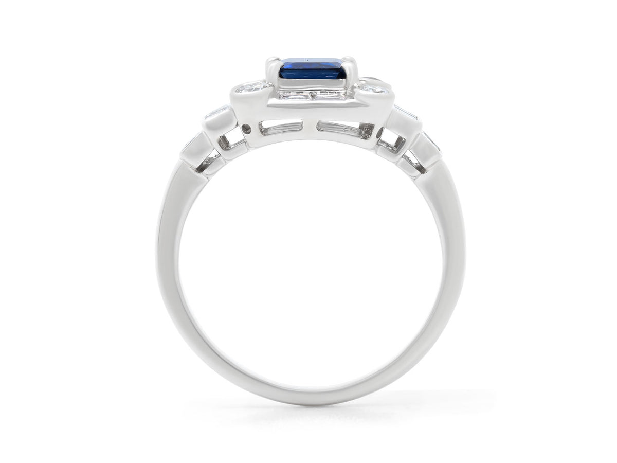 Side view of a platinum ring with blue sapphire and diamonds