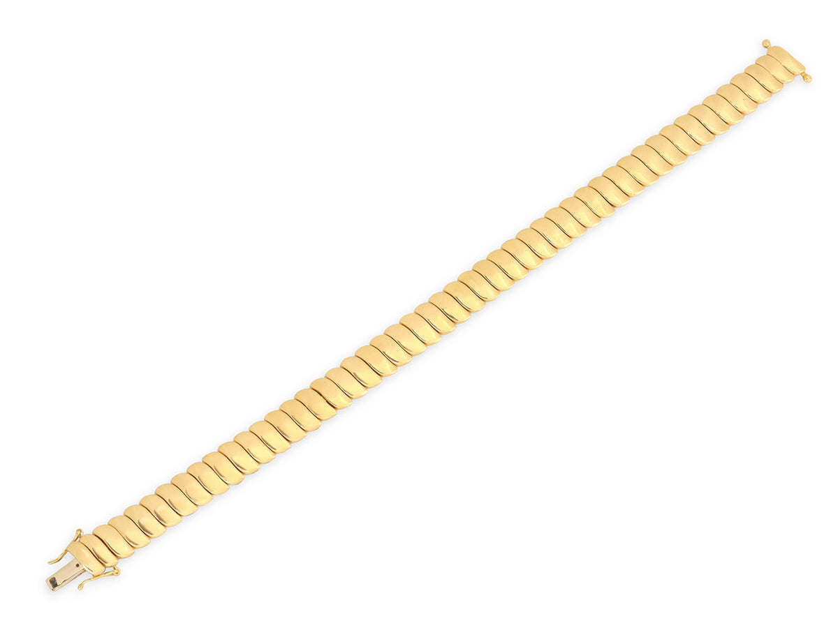 Flexible 18K gold bracelet with wave-shaped links