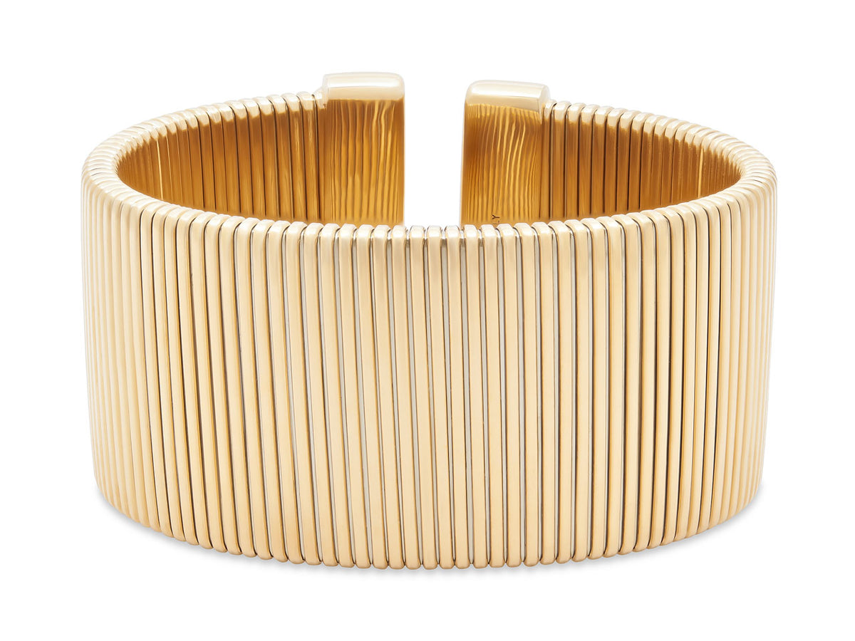 Wide polished 18K yellow gold tubogas cuff bracelet