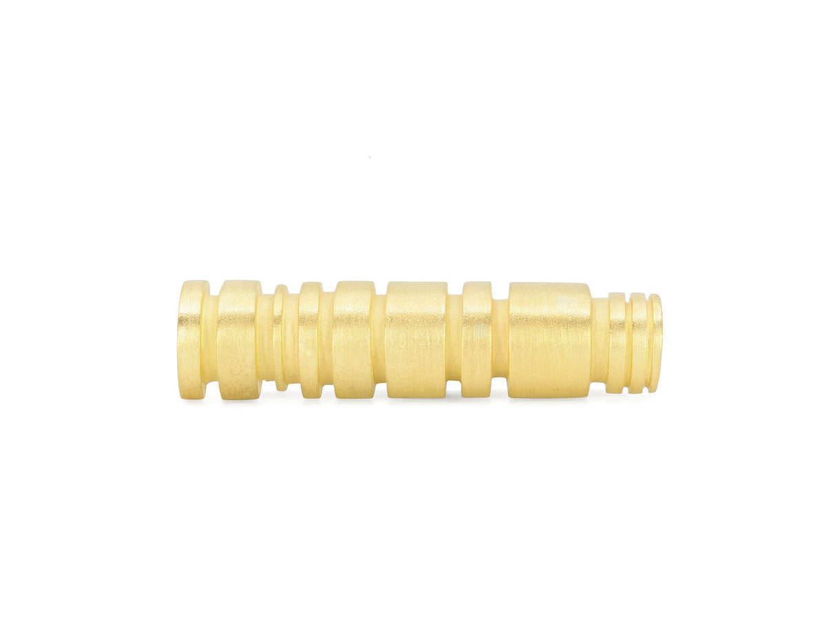 Grooved cylindrical brooch in textured 18K gold