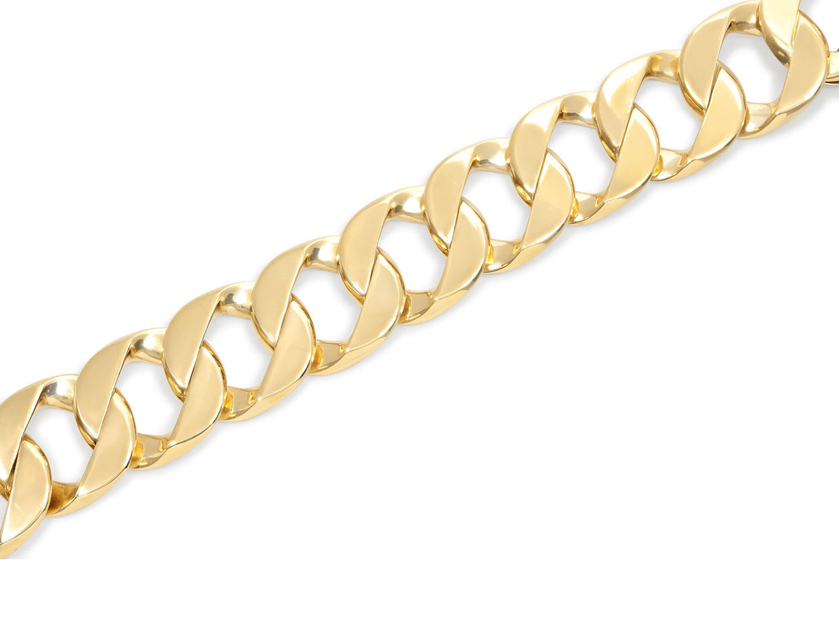 Close-up of polished 18K yellow gold curb links
