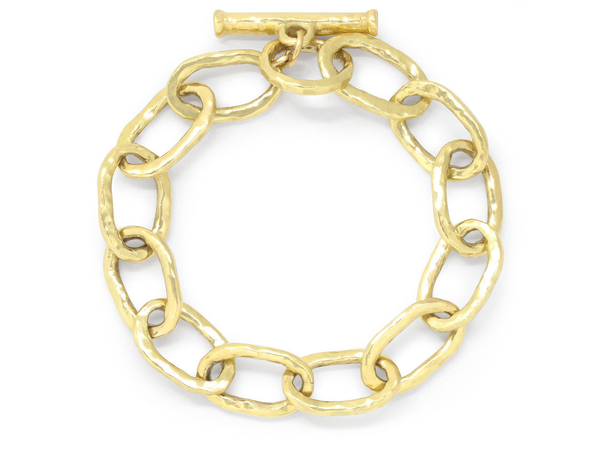 Hand hammered 18K gold oval link bracelet with toggle clasp