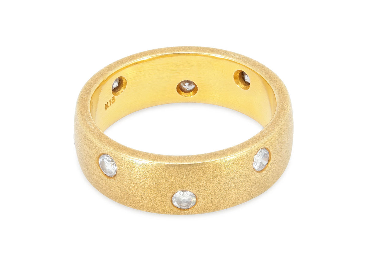 Brushed 18k gold band with flush set diamonds