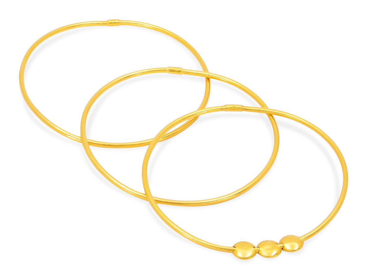 Three 24K gold bangles with three sliding discs