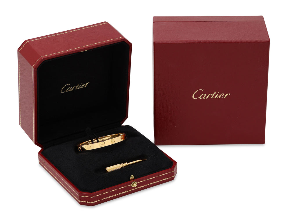 Cartier ring box holding gold Cartier ring