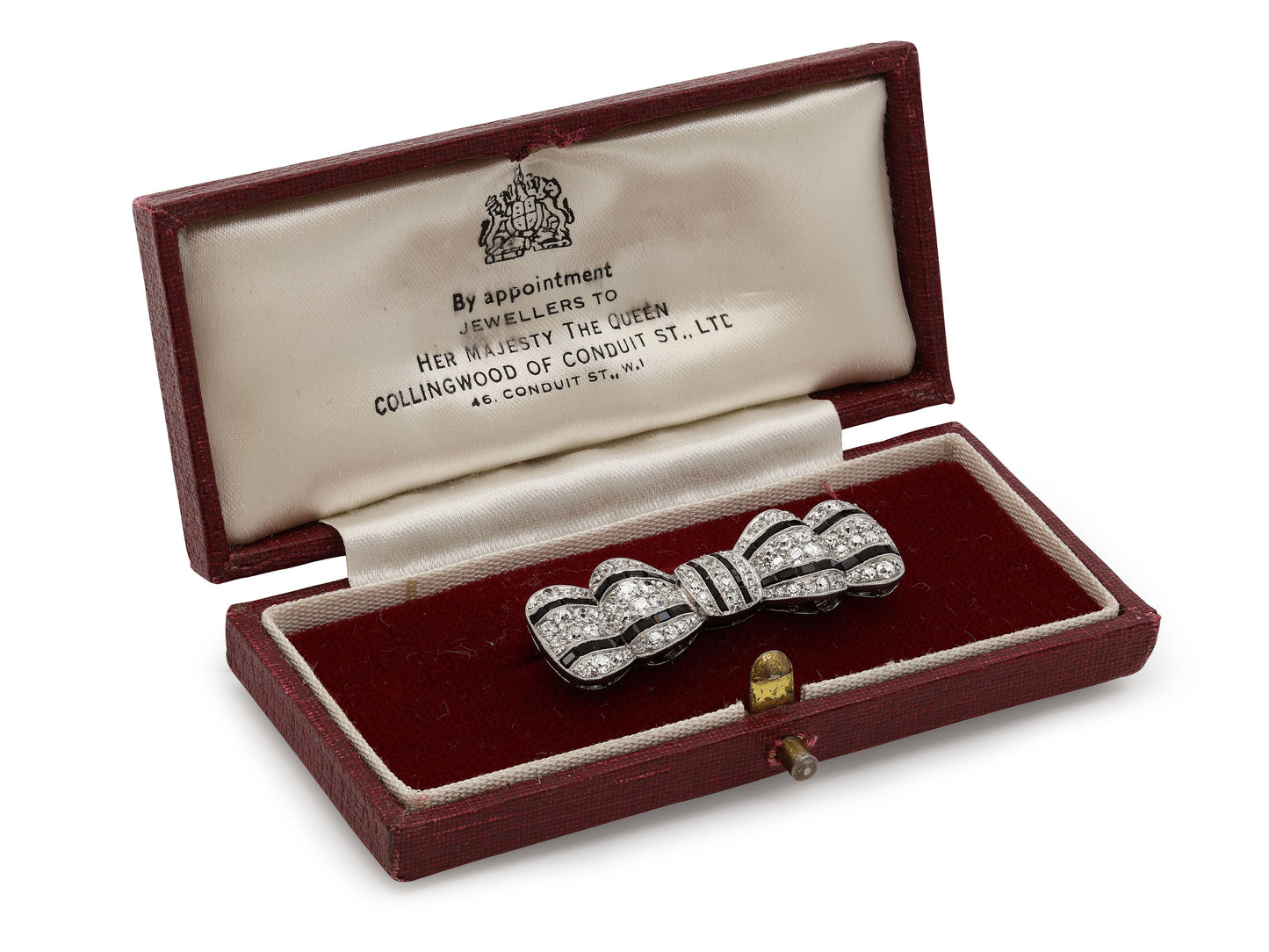 Antique Edwardian Diamond and Onyx Bow Brooch in Platinum