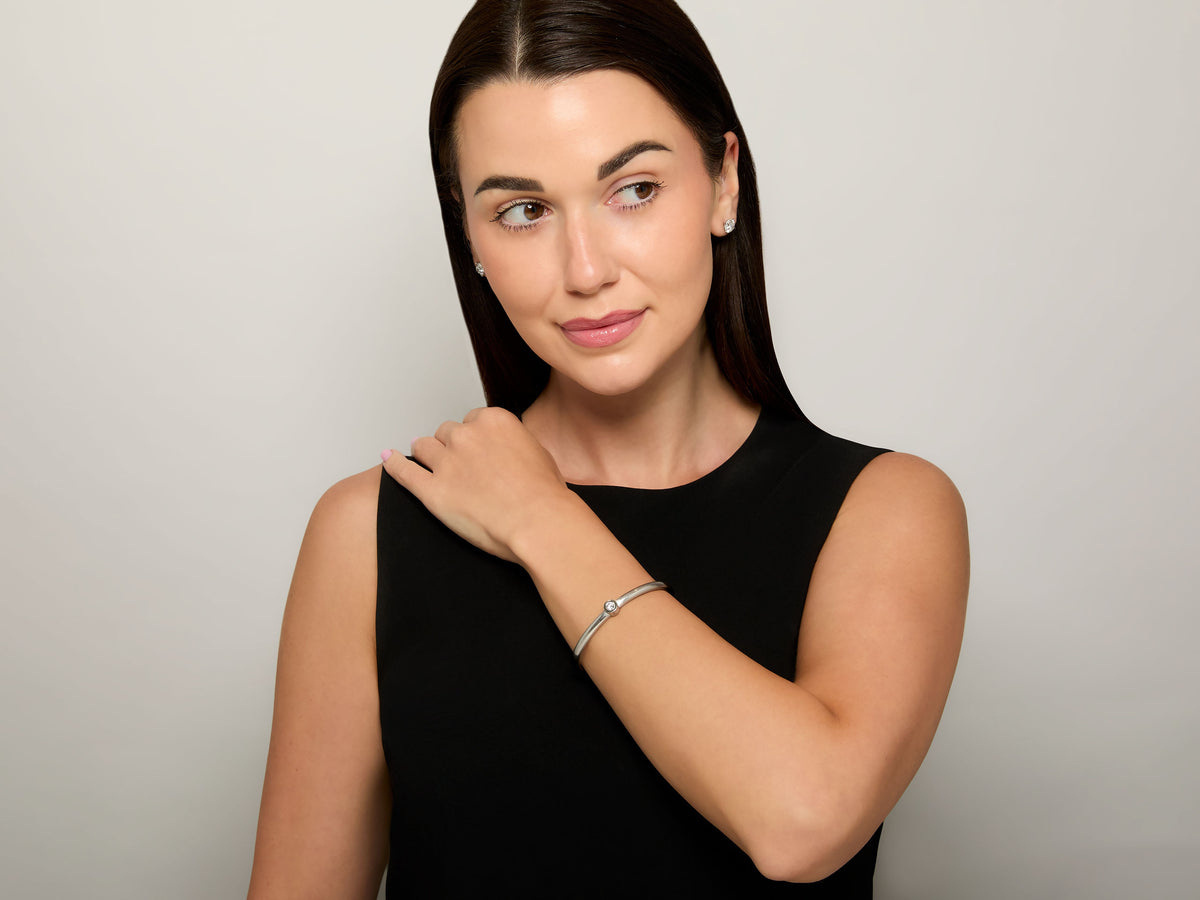 Woman wearing a platinum diamond bangle bracelet