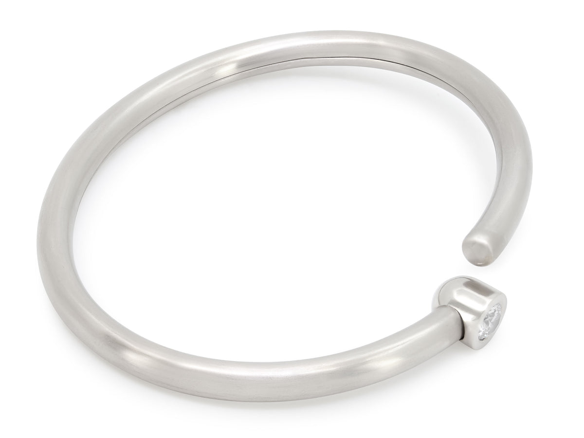 Platinum bangle bracelet with bezel set diamond clasp