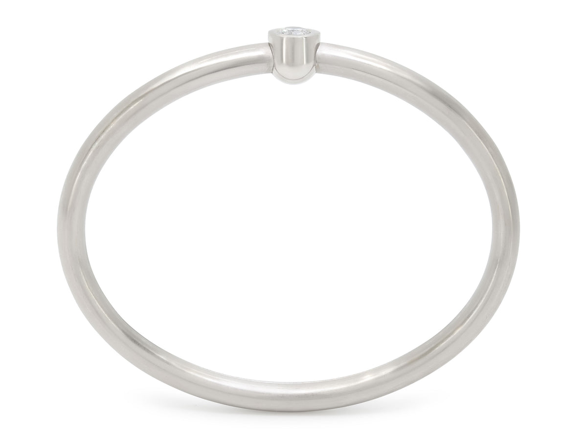 Platinum bangle bracelet with central diamond clasp
