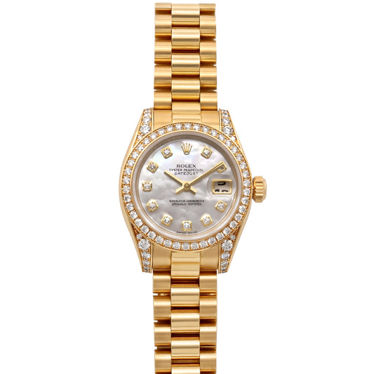 Rolex Ladies 'Datejust' in 18K Gold, 26 mm, with mother of pearl dial, diamond markers, diamond bezel and lugs, date window, and President bracelet by Beladora