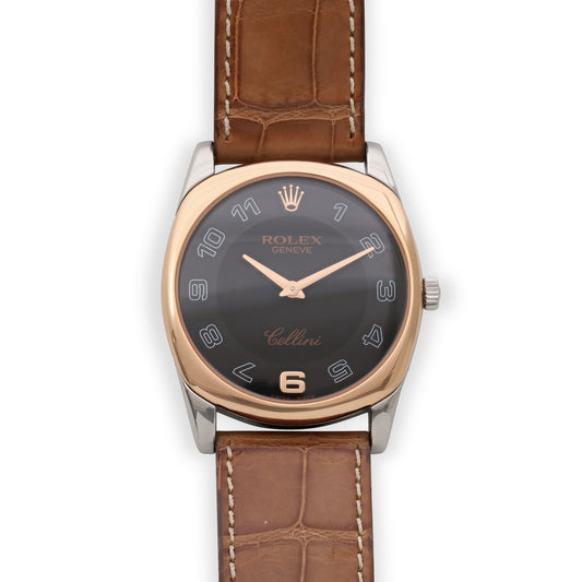 Rolex 'Cellini' Watch in 18K White and Rose Gold with black dial, rose gold bezel, white gold case, and brown leather strap from Beladora