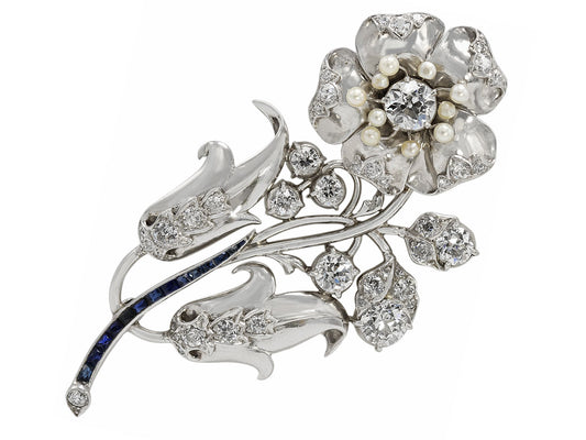 Retro Diamond, Sapphire, and Seed Pearl Flower Brooch in Platinum
